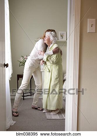 Stock Photography - Mother and daughter hugging. Fotosearch