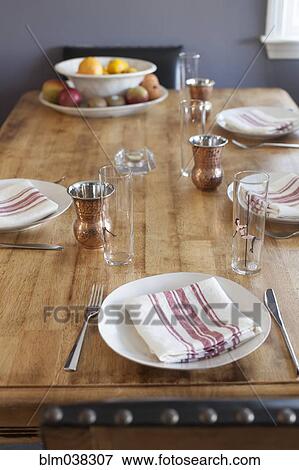 Stock Photo - Napkins and place settings on table. Fotosearch