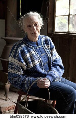 Older Caucasian woman smiling in chair View Large Photo Image Stock Photograph - Older Caucasian woman smiling in chair. Fotosearch