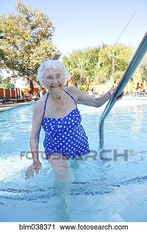Older Caucasian woman walking in swimming pool View Large Photo Image Stock Image - Older Caucasian woman walking in swimming pool. Fotosearch