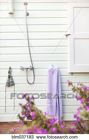Stock Image - Outdoor shower in backyard. Fotosearch
