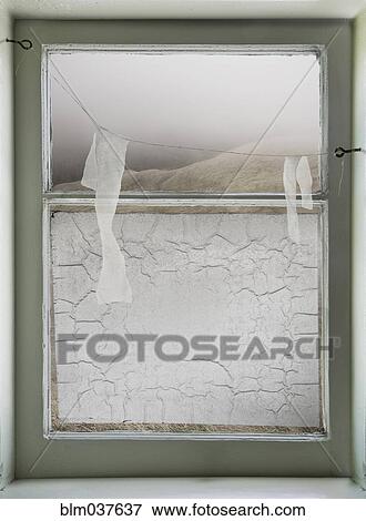 Paper hanging on wire across window View Large Photo Image Stock Photo - Paper hanging on wire across window. Fotosearch