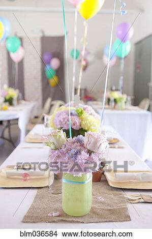 Place settings on party tables under balloons View Large Photo Image Picture - Place settings on party tables under balloons. Fotosearch