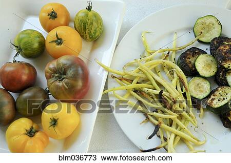 Plates of fresh tomatoes and grilled vegetables View Large Photo Image Stock Image - Plates of fresh tomatoes and grilled vegetables. Fotosearch