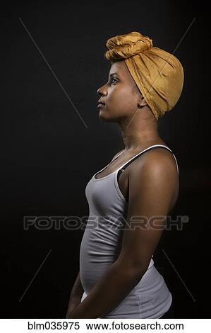 Profile of Black woman wearing headwrap View Large Photo Image Stock Photography - Profile of Black woman wearing headwrap. Fotosearch