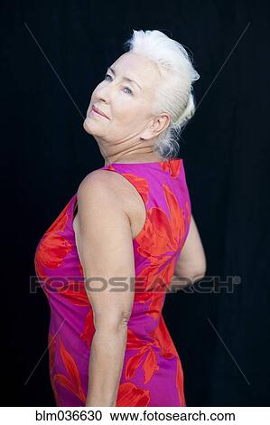 Rear view of smiling Caucasian woman View Large Photo Image Stock Image - Rear view of smiling Caucasian woman. Fotosearch