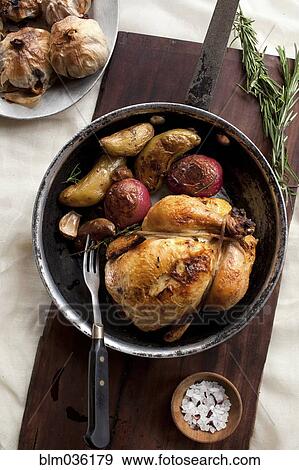 Roast chicken and vegetables in pot View Large Photo Image Stock Photo - Roast chicken and vegetables in pot. Fotosearch