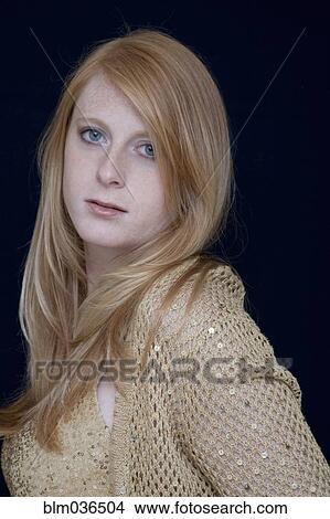 Picture - Serious Caucasian woman with long hair. Fotosearch