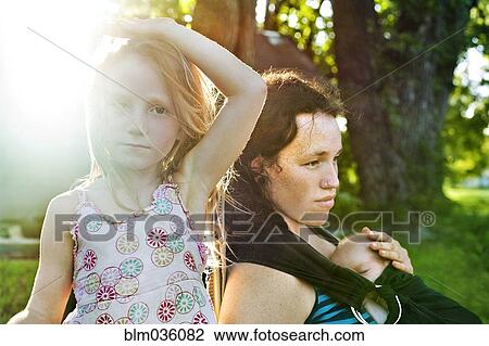 Serious mother and children outdoors View Large Photo Image Stock Image - Serious mother and children outdoors. Fotosearch