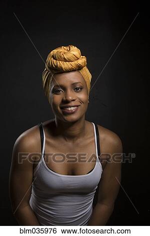 Smiling Black woman wearing headwrap View Large Photo Image Stock Photograph - Smiling Black woman wearing headwrap. Fotosearch
