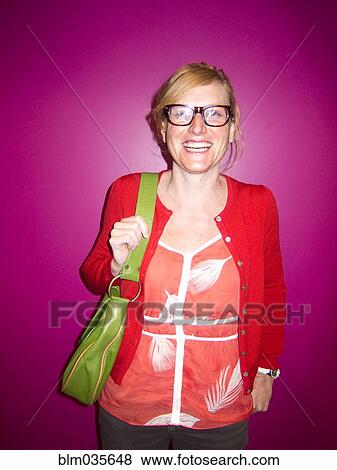 Smiling Caucasian woman wearing eyeglasses View Large Photo Image Stock Photo - Smiling Caucasian woman wearing eyeglasses. Fotosearch