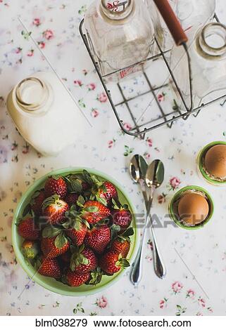 Strawberries, eggs and milk on table View Large Photo Image Stock Photo - Strawberries, eggs and milk on table. Fotosearch