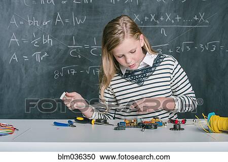 Student building vehicle in science class View Large Photo Image Stock Image - Student building vehicle in science class. Fotosearch