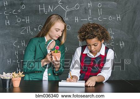 Students doing experiment in science class View Large Photo Image Stock Image - Students doing experiment in science class. Fotosearch