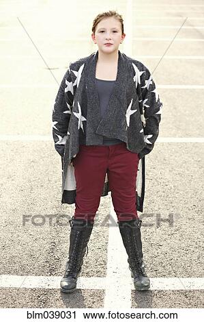 Stylish Caucasian girl standing in parking lot View Large Photo Image Stock Image - Stylish Caucasian girl standing in parking lot. Fotosearch