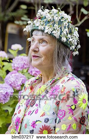 Stock Photo - Stylish older Caucasian woman wearing floral cap. Fotosearch