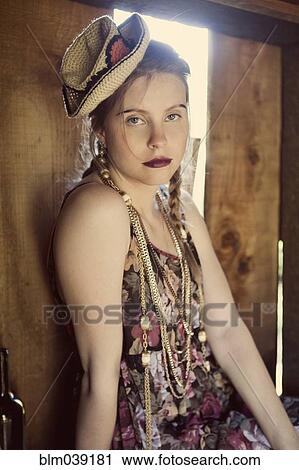 Stylish woman sitting in barn window View Large Photo Image Stock Image - Stylish woman sitting in barn window. Fotosearch