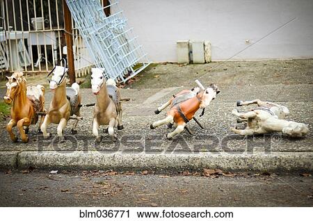 Toy rocking horses on city sidewalk View Large Photo Image Stock Image - Toy rocking horses on city sidewalk. Fotosearch