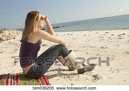 Woman admiring ocean view from beach View Large Photo Image Stock Photography - Woman admiring ocean view from beach. Fotosearch