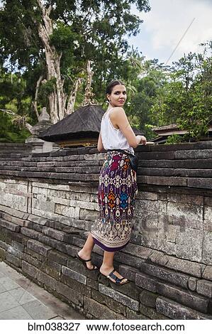 Woman climbing on stone wall View Large Photo Image Stock Photo - Woman climbing on stone wall. Fotosearch