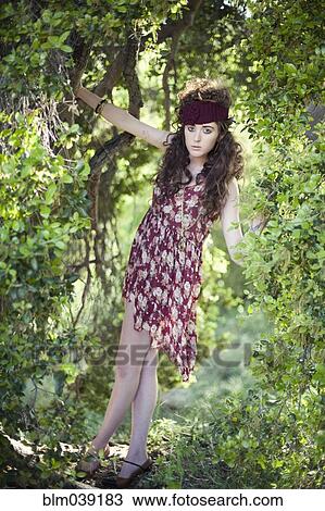 Woman in vintage dress climbing tree View Large Photo Image Stock Image - Woman in vintage dress climbing tree. Fotosearch