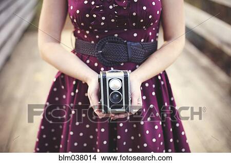 Woman photographing with vintage camera View Large Photo Image Picture - Woman photographing with vintage camera. Fotosearch