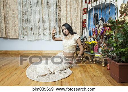 Woman posing in traditional dress and jewelry View Large Photo Image Stock Photo - Woman posing in traditional dress and jewelry. Fotosearch