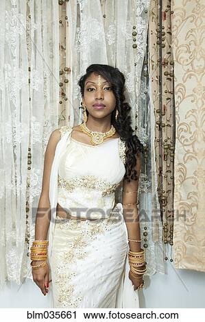 Woman posing in traditional dresses and jewelry View Large Photo Image Stock Image - Woman posing in traditional dresses and jewelry. Fotosearch