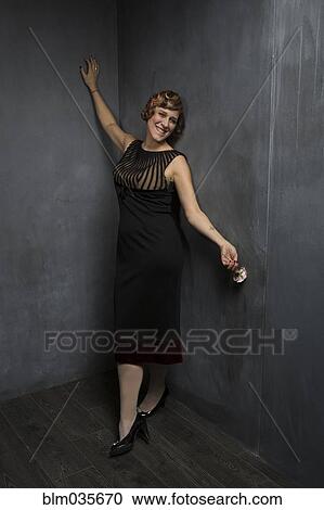 Woman posing in vintage style dress View Large Photo Image Stock Image - Woman posing in vintage style dress. Fotosearch