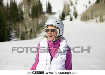 Woman skiing on snowy slope View Large Photo Image Stock Photography - Woman skiing on snowy slope. Fotosearch