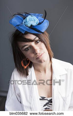 Woman wearing tulle head piece and white shirt View Large Photo Image Stock Image - Woman wearing tulle head piece and white shirt. Fotosearch