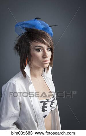 Woman wearing tulle head piece and white shirt View Large Photo Image Stock Image - Woman wearing tulle head piece and white shirt. Fotosearch