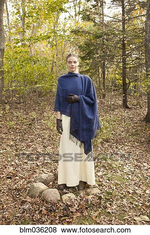 Woman wrapped in shawl in forest View Large Photo Image Stock Photo - Woman wrapped in shawl in forest. Fotosearch