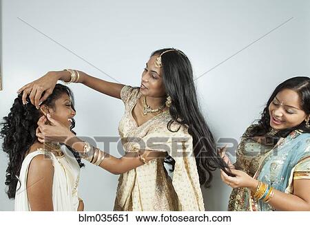 Women dressing in traditional dresses and jewelry View Large Photo Image Stock Image - Women dressing in traditional dresses and jewelry. Fotosearch