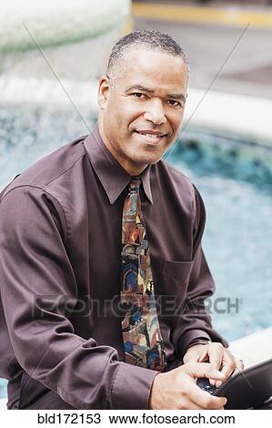African American businessman working at fountain View Large Photo Image Stock Image - African American businessman working at fountain. Fotosearch