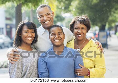 African American family smiling in city View Large Photo Image Stock Photograph - African American family smiling in city. Fotosearch