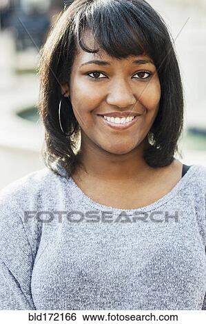 African American teenage girl smiling outdoors View Large Photo Image Stock Photograph - African American teenage girl smiling outdoors. Fotosearch
