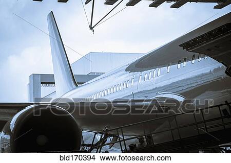 Picture - Airplane parked in airport. Fotosearch