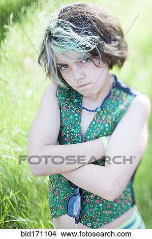 Picture - Angry mixed race girl crossing her arms. Fotosearch