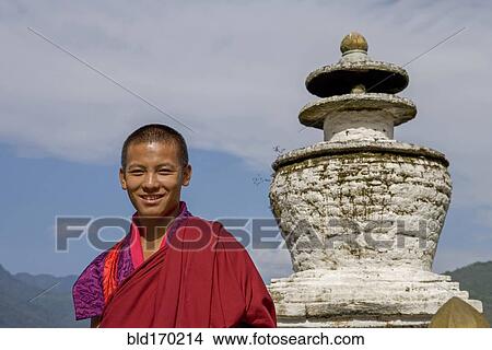 Asian boy smiling near statue View Large Photo Image Picture - Asian boy smiling near statue. Fotosearch