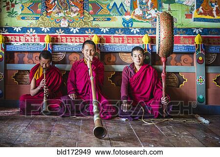 Stock Photo - Asian monks playing instruments on temple floor. Fotosearch