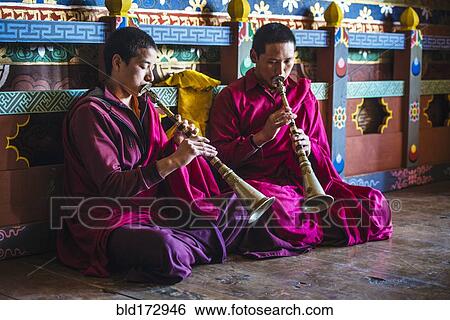 Stock Photograph - Asian monks playing instruments on temple floor. Fotosearch