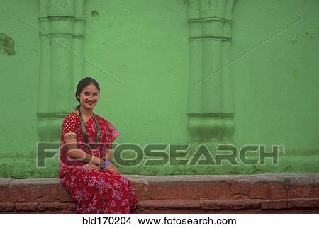 Asian woman wearing traditional clothing View Large Photo Image Picture - Asian woman wearing traditional clothing. Fotosearch