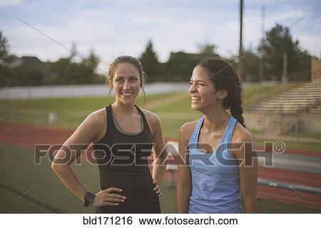 Athletes standing on sports field View Large Photo Image Stock Photograph - Athletes standing on sports field. Fotosearch