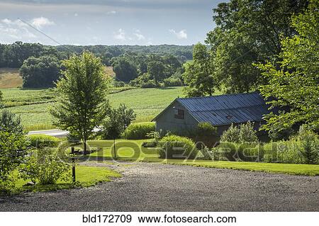 Stock Photo - Barn building on farm in rural landscape. Fotosearch
