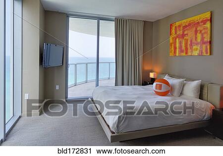Beach ball on bed in hotel room View Large Photo Image Stock Image - Beach ball on bed in hotel room. Fotosearch