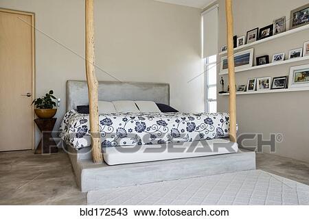 Bed and bedposts in modern bedroom View Large Photo Image Stock Image - Bed and bedposts in modern bedroom. Fotosearch