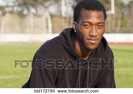 Picture - Black athlete on sports field. Fotosearch