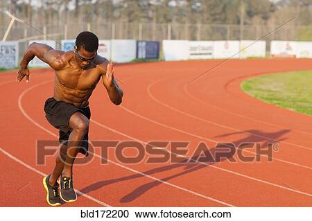 Black athlete running on track in sports field View Large Photo Image Stock Image - Black athlete running on track in sports field. Fotosearch