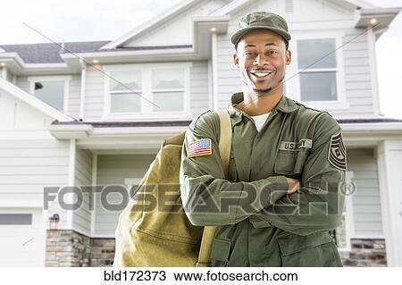 Black soldier standing outside house View Large Photo Image Stock Image - Black soldier standing outside house. Fotosearch